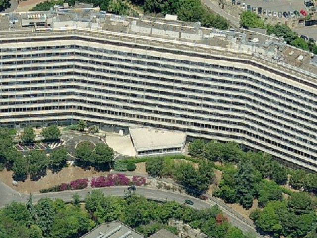 The main campus of our School of Medicine with the San Martino Hospital. The red arrows points to the Erasmus office in the administrative building.